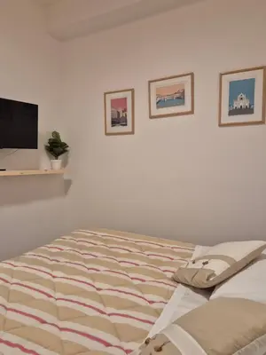 Letto o letti in una camera di VerdeLuna Home