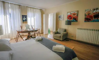 Letto o letti in una camera di Acacia Firenze Apartments Artemisia-Angelica