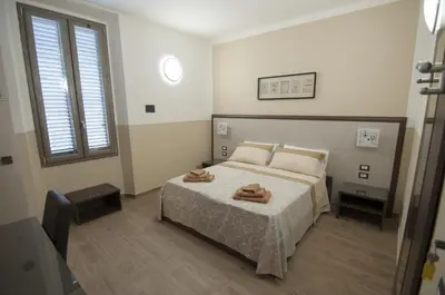 Letto o letti in una camera di Guesthouse Buonarroti Florence