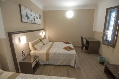 Letto o letti in una camera di Guesthouse Buonarroti Florence