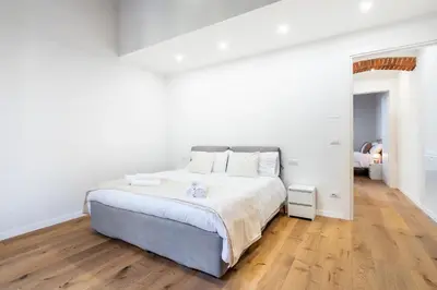 Letto o letti in una camera di Scandicci Elite Home - Casa Moderna con Cortile e Parcheggio Gratuito