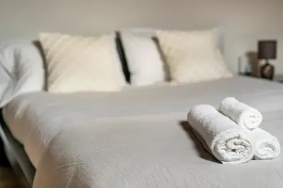 Letto o letti in una camera di Scandicci Elite Home - Casa Moderna con Cortile e Parcheggio Gratuito