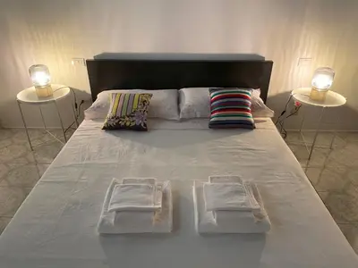 Letto o letti in una camera di Michelangiolo Appartment