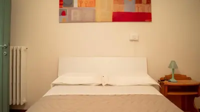 Letto o letti in una camera di casa miranda - terrace on the river near Florence