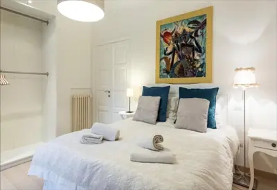 Letto o letti in una camera di Ser Masaccio Apartment
