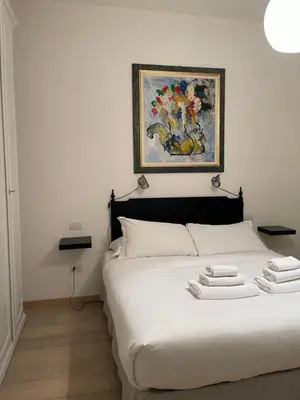 Letto o letti in una camera di Ser Masaccio Apartment