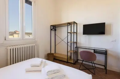 Letto o letti in una camera di Santa Maria Novella penthouse by MMega