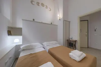 Letto o letti in una camera di Signoria Square Apartment