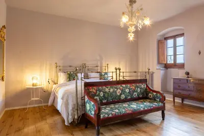 Letto o letti in una camera di Dimora Boccaccio by VacaVilla