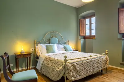 Letto o letti in una camera di Dimora Boccaccio by VacaVilla