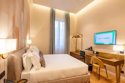 Letto o letti in una camera di Palazzo Don Minzoni