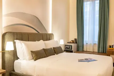 Letto o letti in una camera di Palazzo Don Minzoni