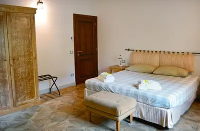 Letto o letti in una camera di Armonie di Villa Incontri B&B