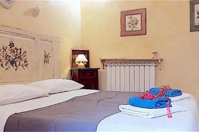 Letto o letti in una camera di Amo e Flo