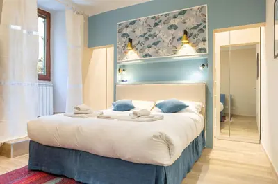 Letto o letti in una camera di Sant'Ambrogio Elegant Apartment