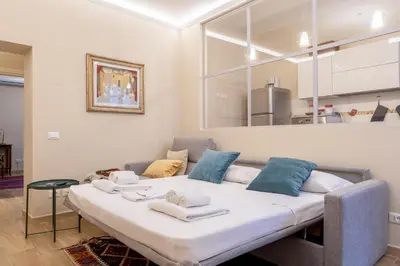 Letto o letti in una camera di Sant'Ambrogio Elegant Apartment