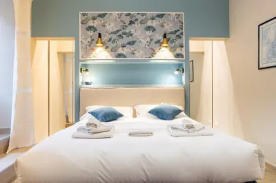 Letto o letti in una camera di Sant'Ambrogio Elegant Apartment