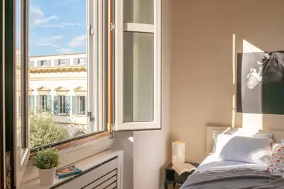 Letto o letti in una camera di Golden House San Lorenzo
