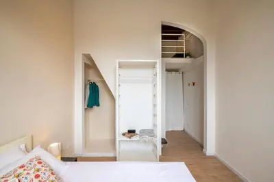 Letto o letti in una camera di Golden House San Lorenzo