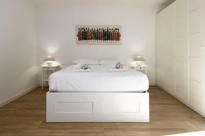 Letto o letti in una camera di UNYCA - Elegant Apartment in Oltrarno Florence