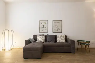 Area soggiorno di UNYCA - Elegant Apartment in Oltrarno Florence
