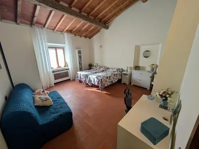Letto o letti in una camera di Casa Benvenuti