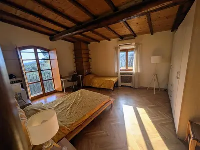 Letto o letti in una camera di Casa Benvenuti