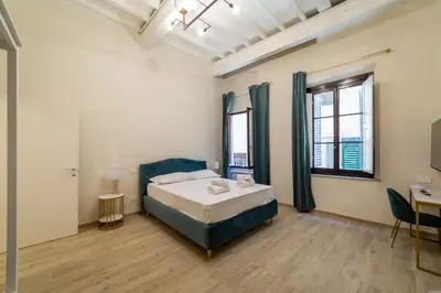 Letto o letti in una camera di appartamento Via deiNeri 22