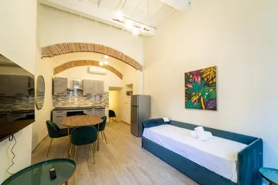 Letto o letti in una camera di appartamento Via deiNeri 22