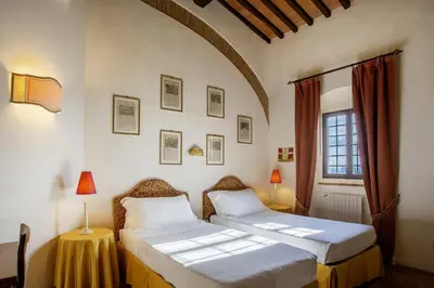 Letto o letti in una camera di Castello di Montemasso B&B