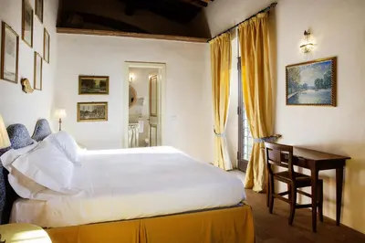 Letto o letti in una camera di Castello di Montemasso B&B