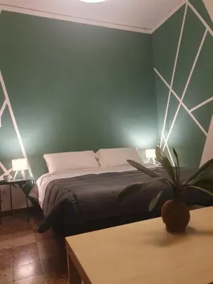 Letto o letti in una camera di Casa Maki Firenze
