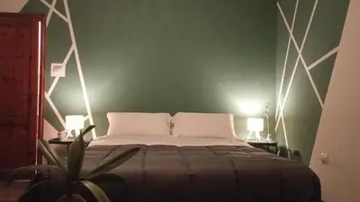 Letto o letti in una camera di Casa Maki Firenze