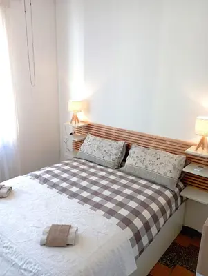 Letto o letti in una camera di Casa Maki Firenze