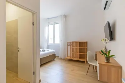 Letto o letti in una camera di Casa Eleonora