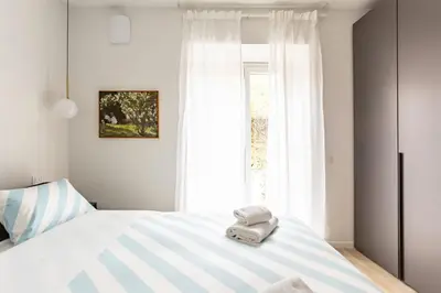 Letto o letti in una camera di GuestHost - Galliano 24 - Lovely Nest in Florence