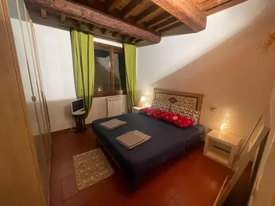 Letto o letti in una camera di Casa Orisogi centro Storico Piazza Santa Croce