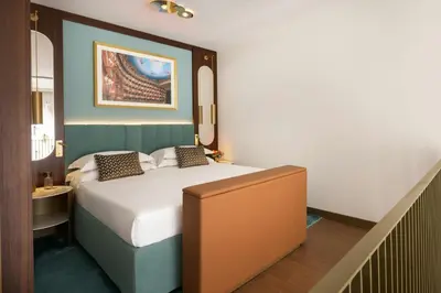 Letto o letti in una camera di Teatro Luxury Apartments Firenze - Starhotels Collezione