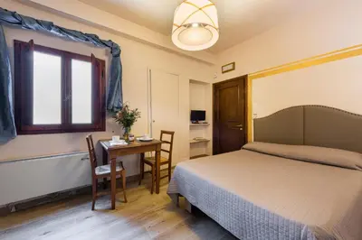 Letto o letti in una camera di Apartments Florence - Ariento Vittoria
