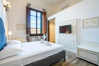 Letto o letti in una camera di Residenza Signorile nel Cuore di Firenze