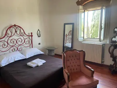 Letto o letti in una camera di La Casa di Dante Fiesole