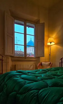 Letto o letti in una camera di Apartment in the center of Florence with a view
