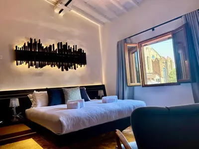 Letto o letti in una camera di Opus Firenze Boutique B&B Santa Croce City Center