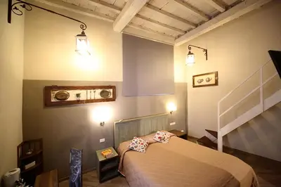 Letto o letti in una camera di B&B Locanda Il Salimbecco