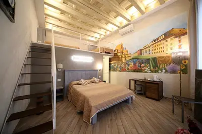 Letto o letti in una camera di B&B Locanda Il Salimbecco