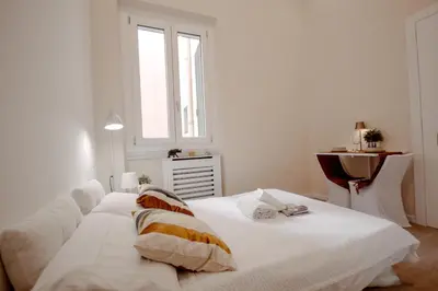 Letto o letti in una camera di Novella Golden Loft