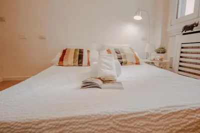 Letto o letti in una camera di Novella Golden Loft