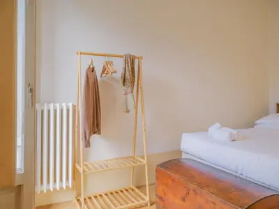 Letto o letti in una camera di Nugolo atelier - Light & charm in Oltrarno