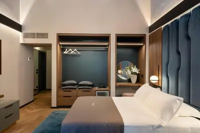 Letto o letti in una camera di Arts & Crafts Luxury Suites