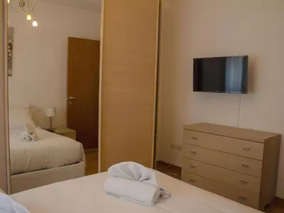 Letto o letti in una camera di Casa IL FIORE